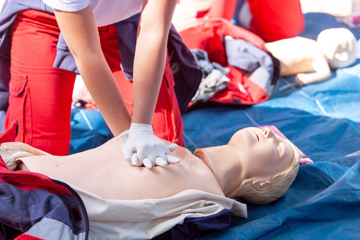 Trainees practice CPR on a training dummy