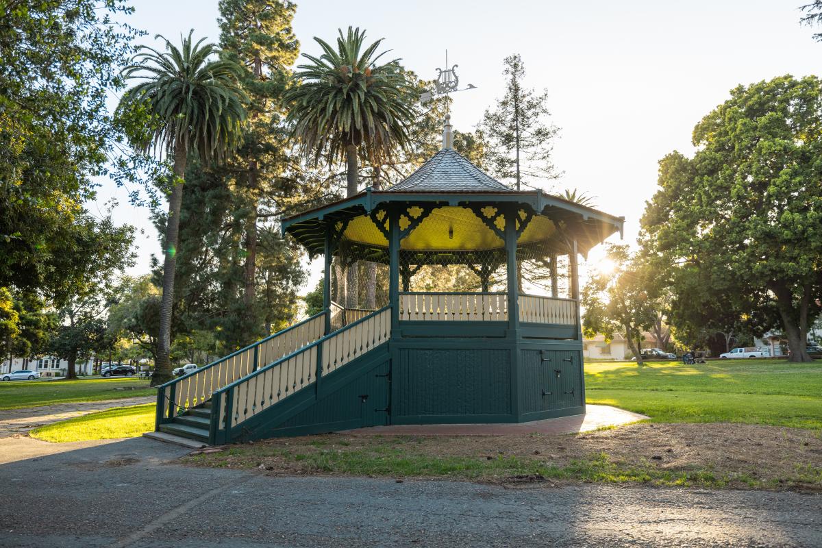 Alameda Park Bandstand with weathervane on top and grassy area around