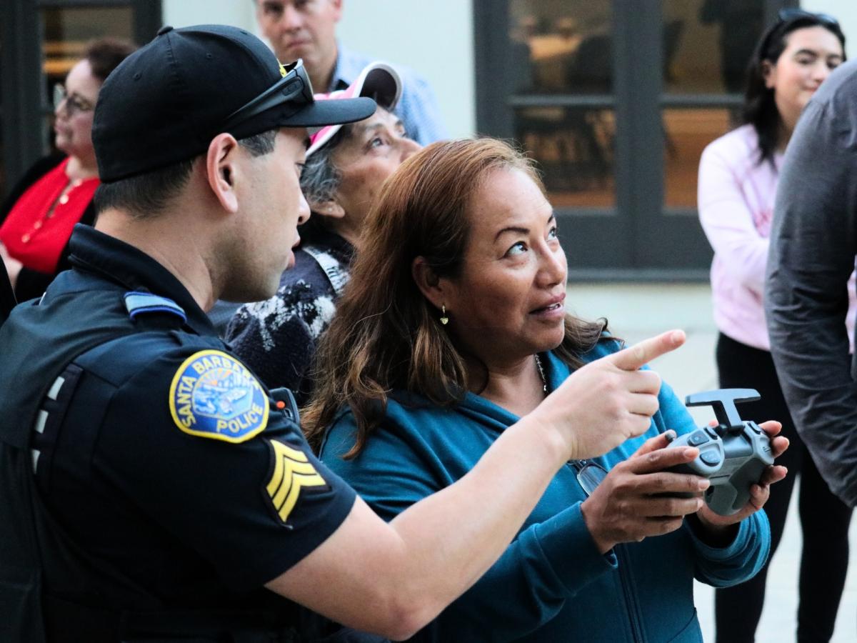 Community Academy Participant Using the Lidar Radar Gun